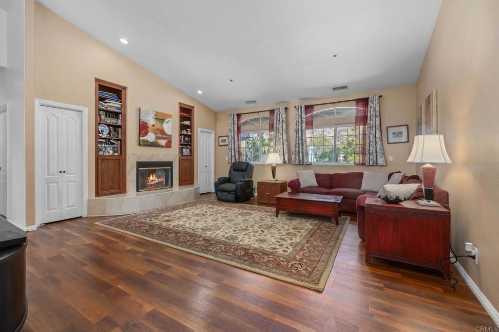 7635 Little Creek Road San Marcos, CA 92078 - Photo 5 of 48 a living room with fireplace furniture and a rug