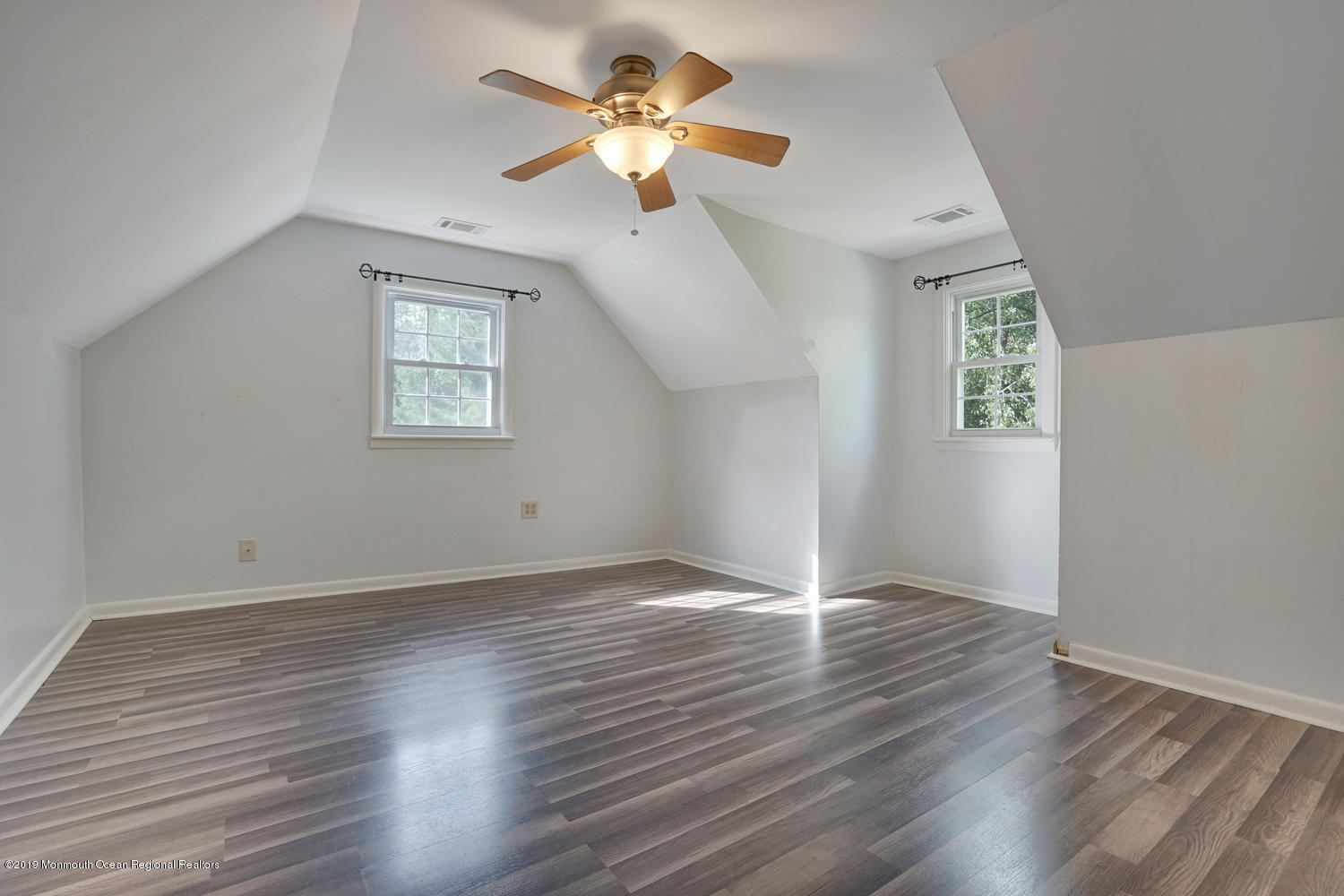 49 Evergreen Drive Jackson, NJ 08527 - Photo 21 of 50 a view of an empty room with wooden floor and a ceiling fan