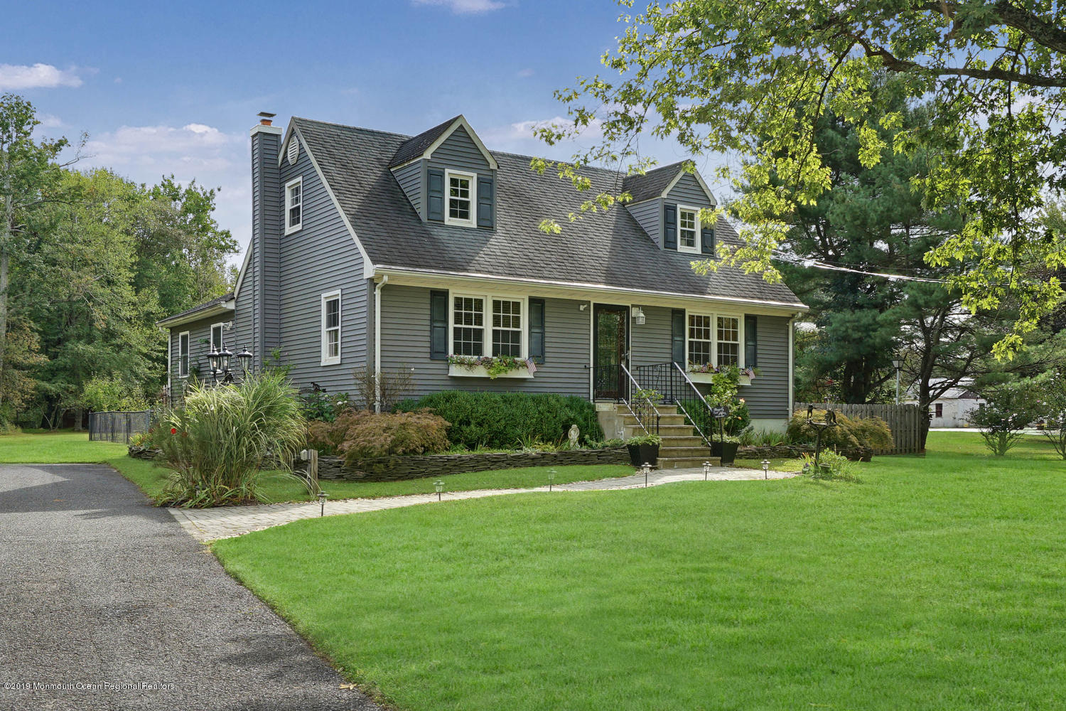49 Evergreen Drive Jackson, NJ 08527 - Photo 33 of 50 a front view of a house with a yard and trees