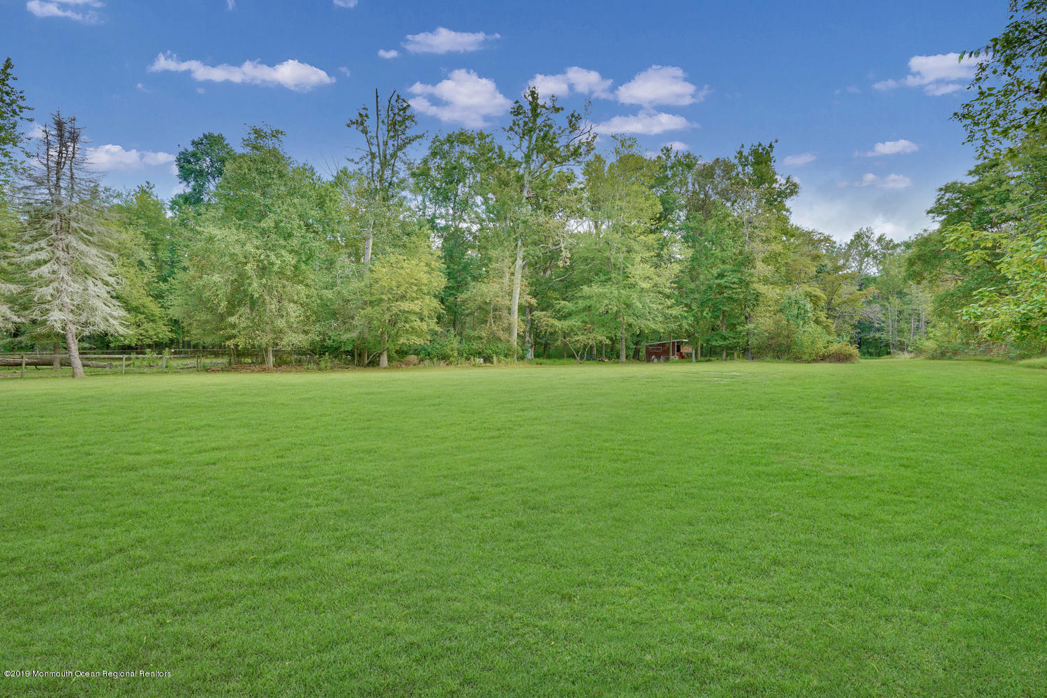 49 Evergreen Drive Jackson, NJ 08527 - Photo 34 of 50 a view of a garden with a building in the background