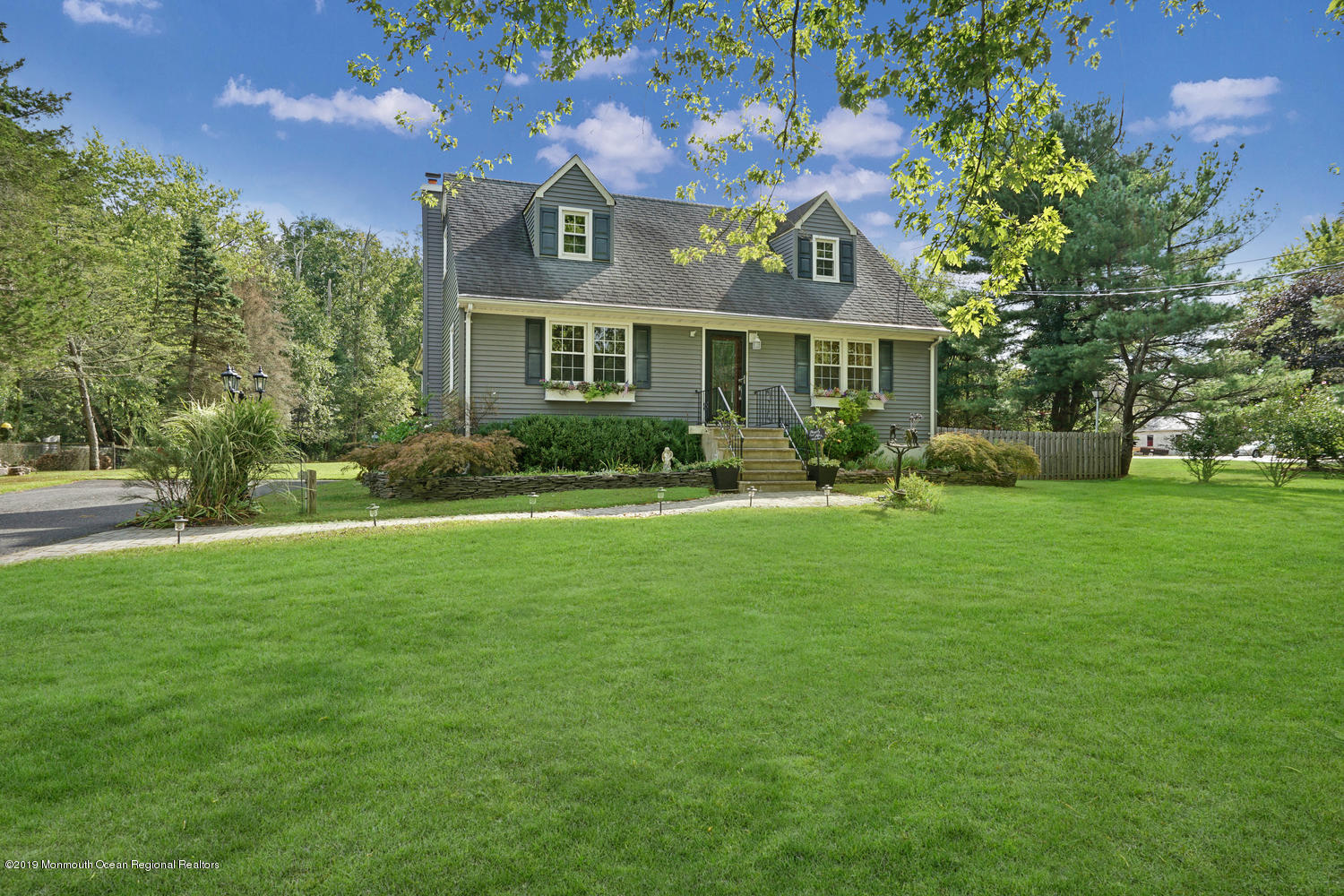 49 Evergreen Drive Jackson, NJ 08527 - Photo 35 of 50 a front view of a house with garden