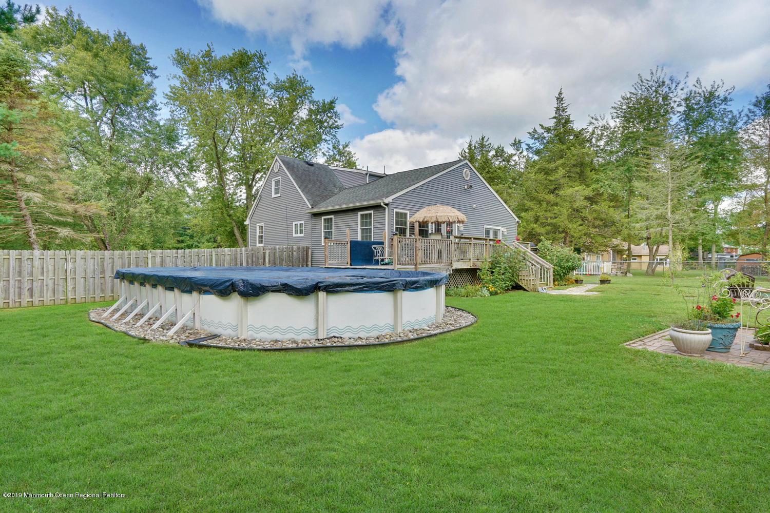 49 Evergreen Drive Jackson, NJ 08527 - Photo 36 of 50 a view of a house with a backyard porch and sitting area