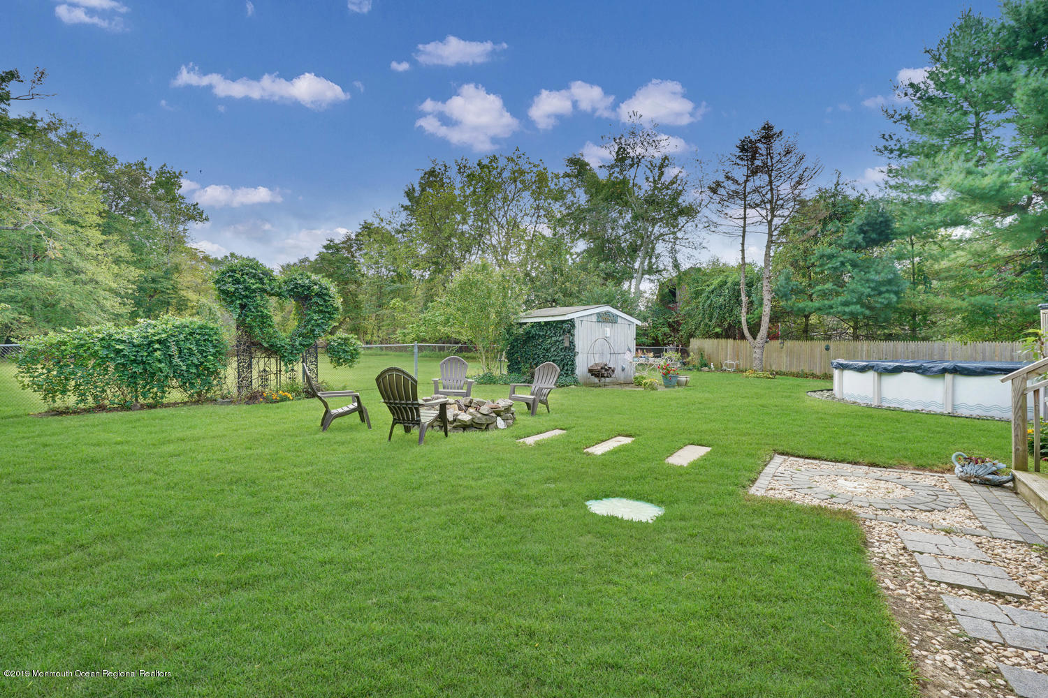 49 Evergreen Drive Jackson, NJ 08527 - Photo 39 of 50 a view of yard with green space and seating area