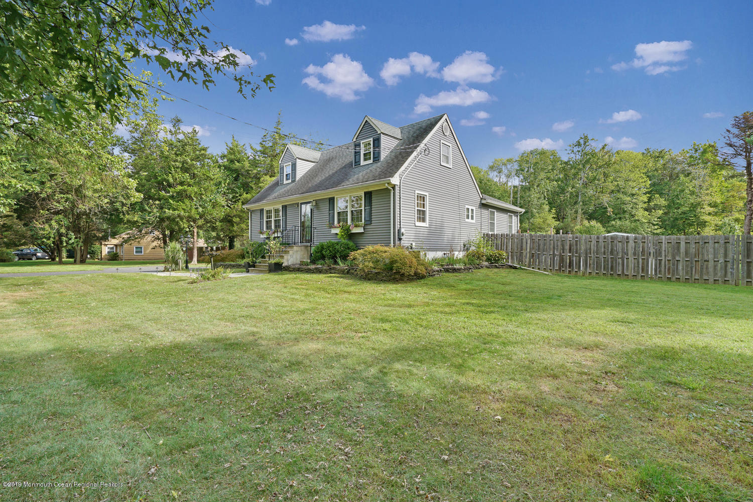 49 Evergreen Drive Jackson, NJ 08527 - Photo 46 of 50 a front view of a house with garden