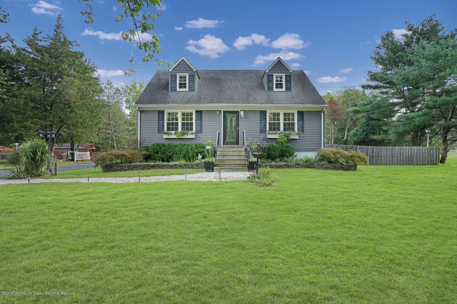 49 Evergreen Drive Jackson, NJ 08527 - Photo 47 of 50 a front view of a house with garden
