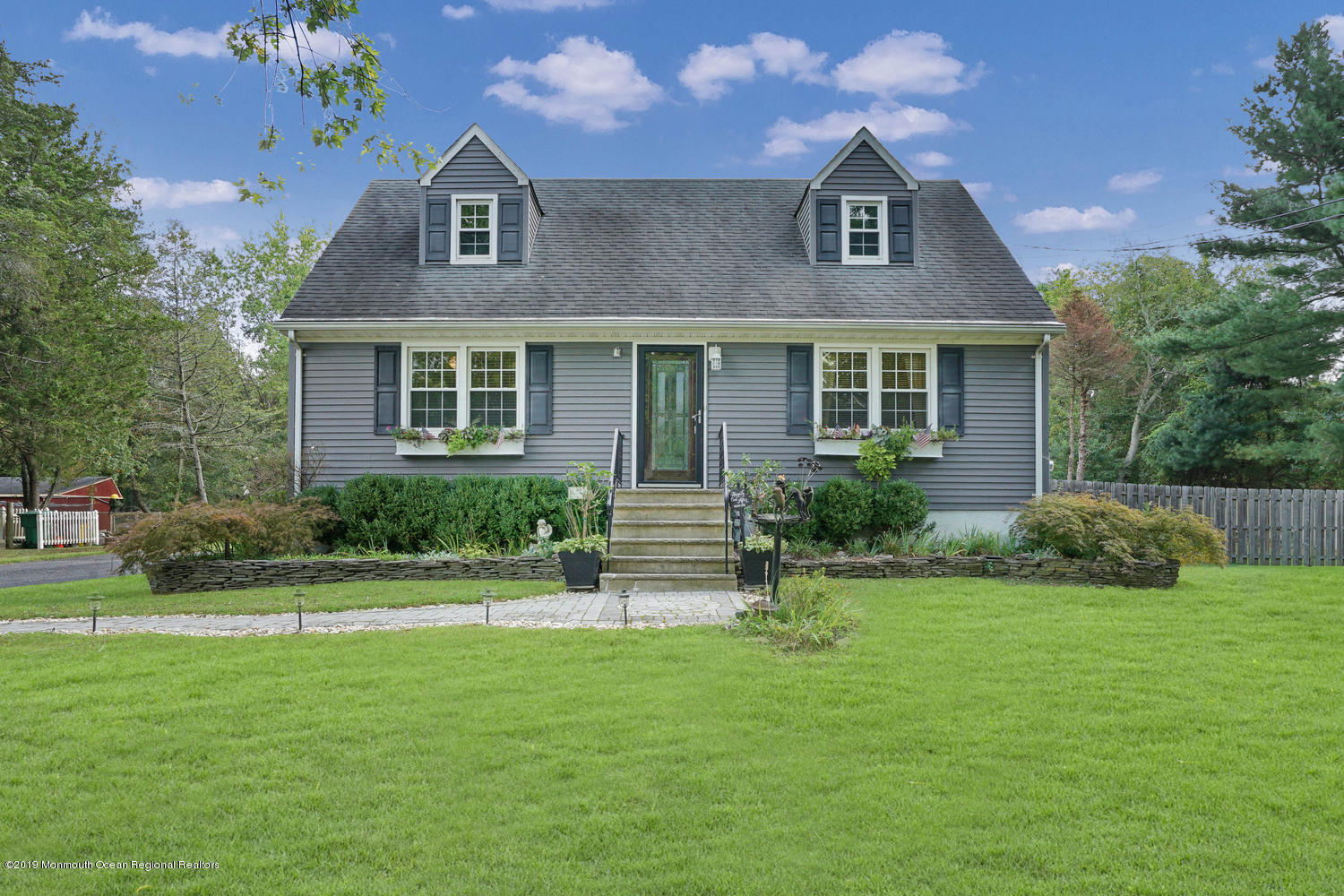 49 Evergreen Drive Jackson, NJ 08527 - Photo 48 of 50 a front view of a house with a yard