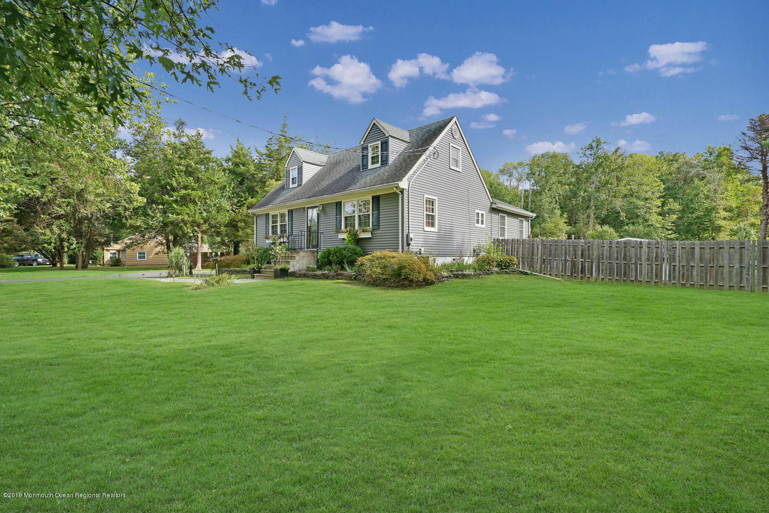 49 Evergreen Drive Jackson, NJ 08527 - Photo 49 of 50 a front view of a house with garden