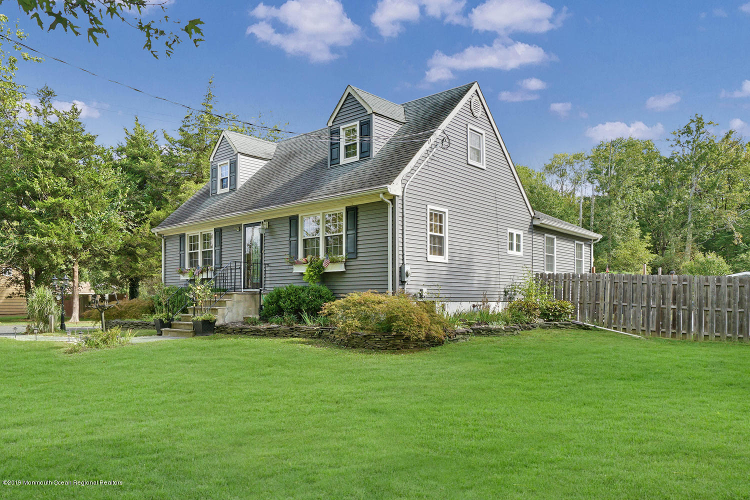 49 Evergreen Drive Jackson, NJ 08527 - Photo 50 of 50 a front view of a house with garden