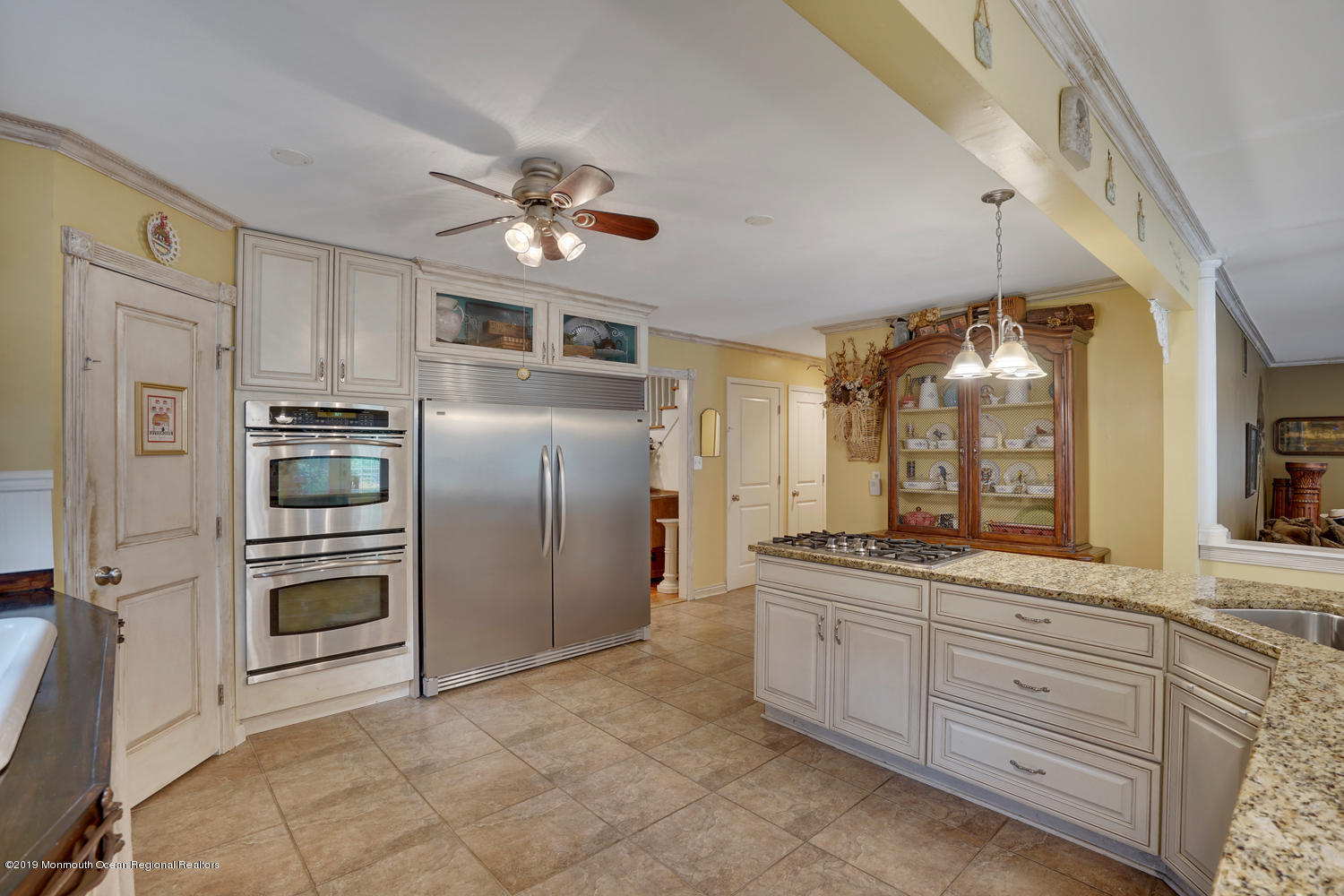 49 Evergreen Drive Jackson, NJ 08527 - Photo 9 of 50 a kitchen with cabinets stainless steel appliances and a window