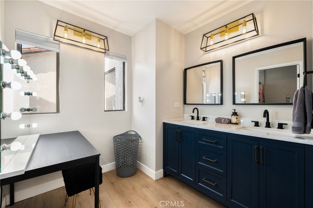 1128 Dawn Ridge Way Covina, CA 91724 - Photo 15 of 32 a en suite bathroom with a toilet a sink and a mirror