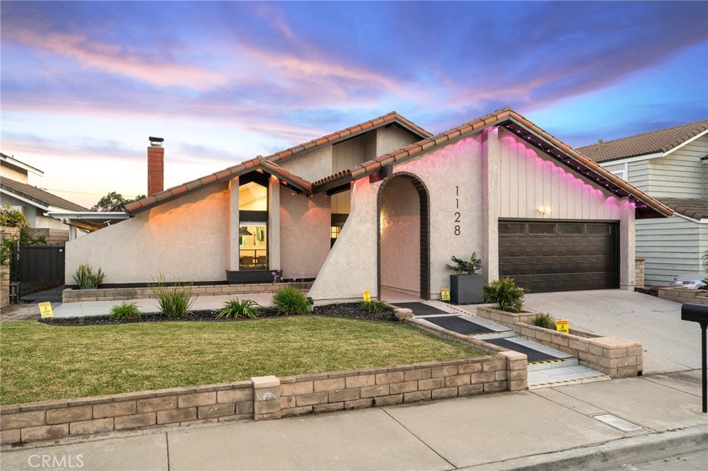 1128 Dawn Ridge Way Covina, CA 91724 - Photo 2 of 32 a front view of a house with a yard