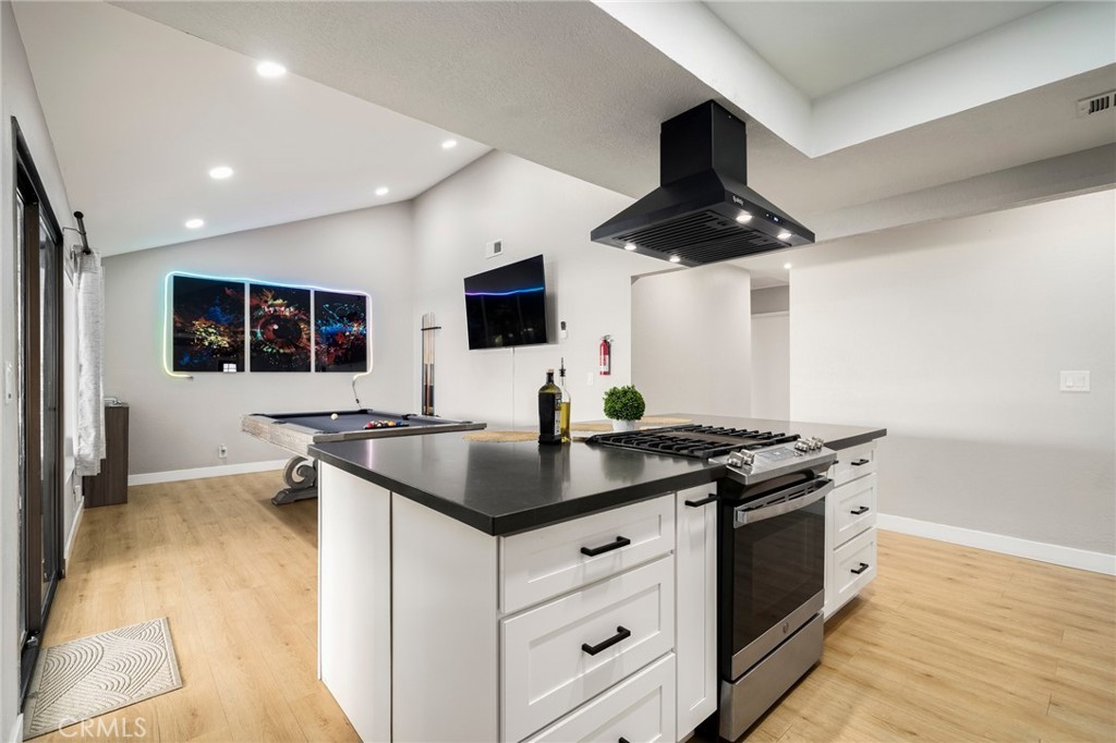1128 Dawn Ridge Way Covina, CA 91724 - Photo 10 of 32 a kitchen with stainless steel appliances a stove a sink and a microwave
