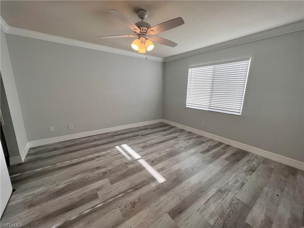 409 Gabriel Circle, Unit 2203 Naples, FL 34104 - Photo 10 of 18 a view of empty room with window