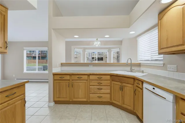 a kitchen with stainless steel appliances granite countertop a sink and a microwave