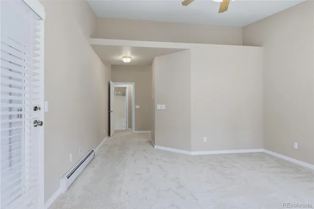 a spacious bathroom with a double vanity sink a mirror and a shower