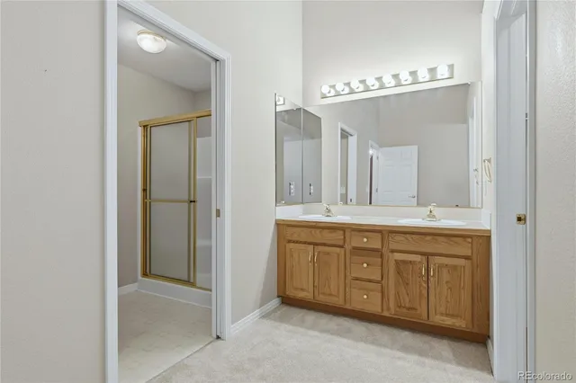 a bathroom with a glass shower door