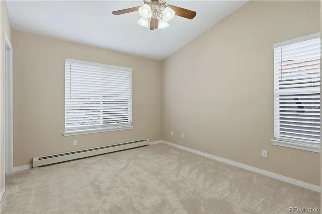 an empty room with closet and a bathroom