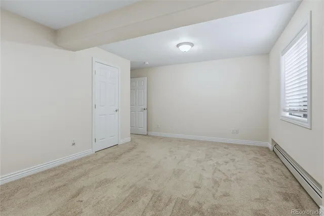 a view of a house with a wooden deck