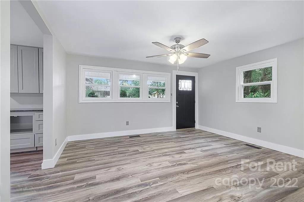 629 2nd Street Southwest, Unit 30 Conover, NC 28613 - Photo 3 of 4 a view of an empty room with wooden floor and a window