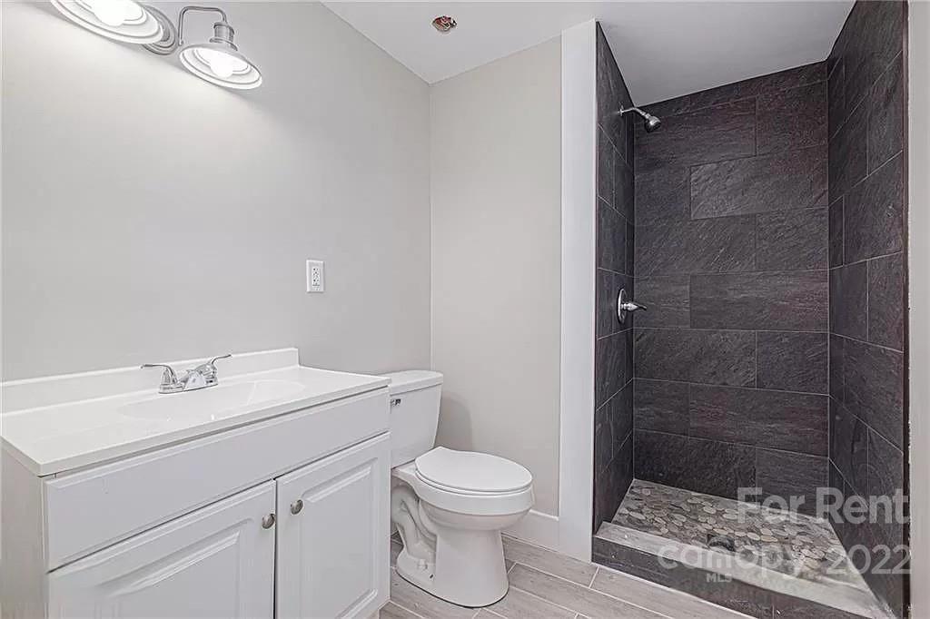 629 2nd Street Southwest, Unit 30 Conover, NC 28613 - Photo 4 of 4 a bathroom with a toilet a sink and shower