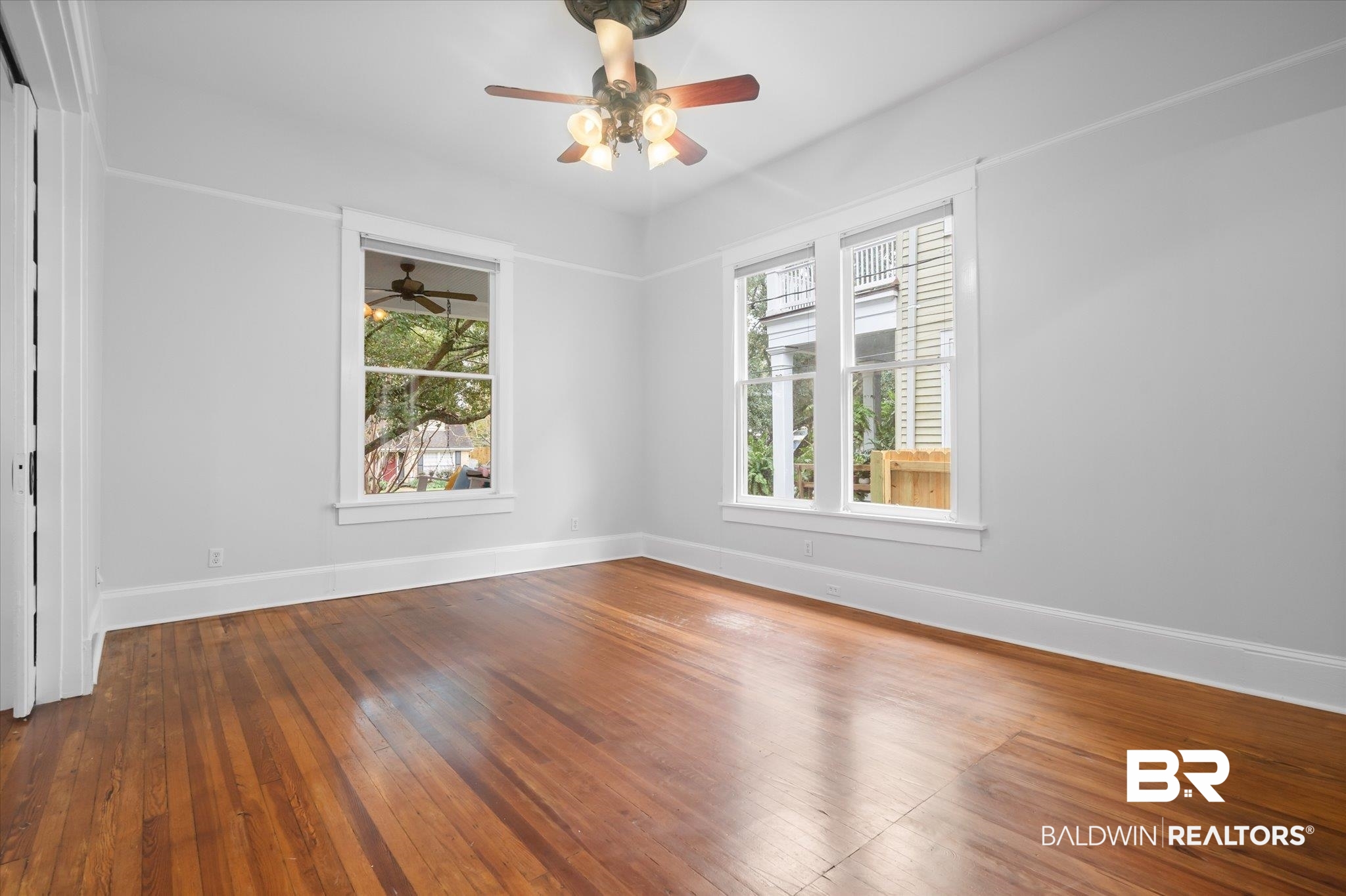 14 South Monterey Street Mobile, AL 36604 - Photo 33 of 41 Unfurnished room with hardwood / wood-style flooring and ceiling fan