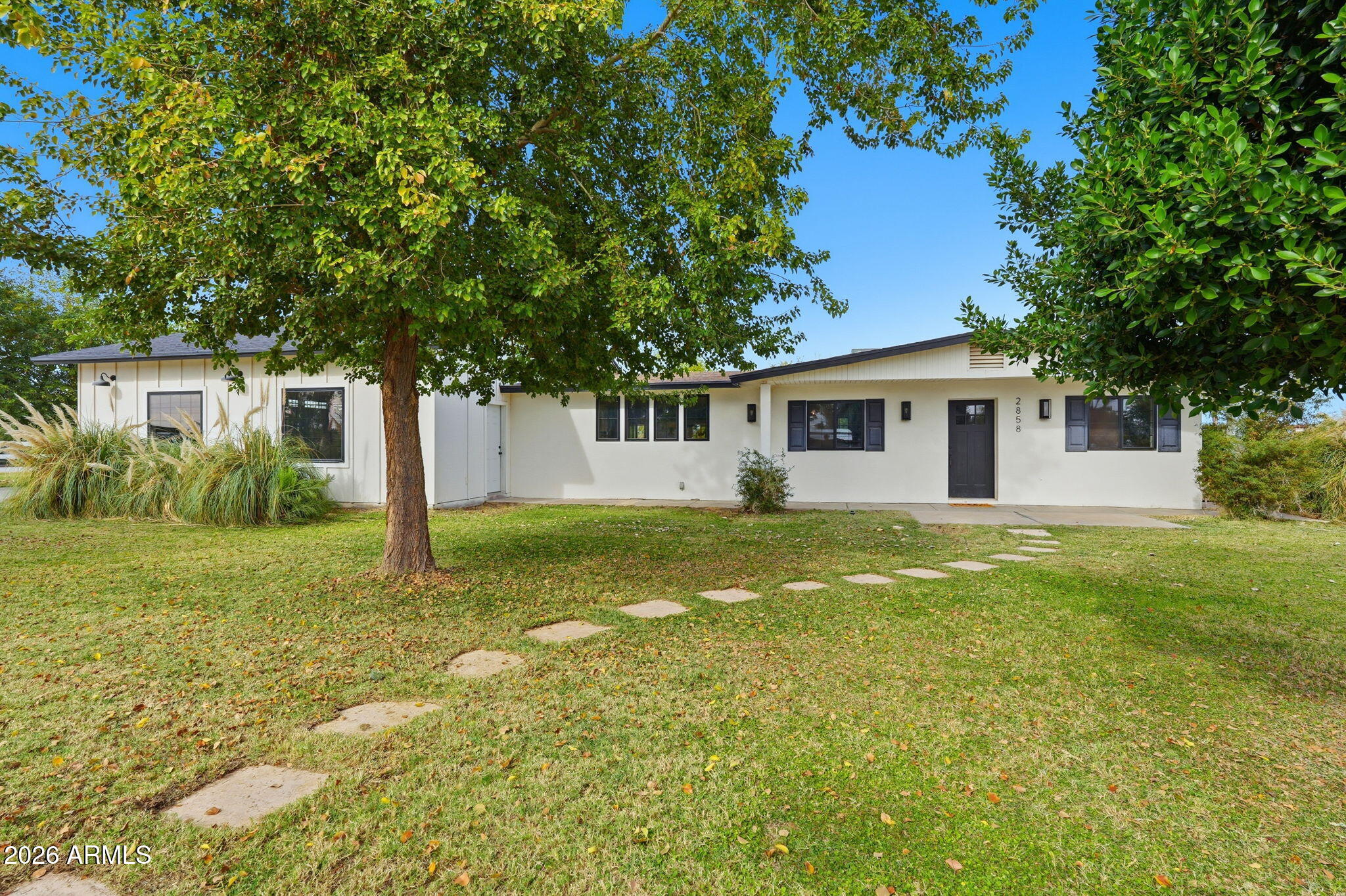 2858 East Redfield Road Gilbert, AZ 85234 - Photo 18 of 60 a view of a house with a backyard