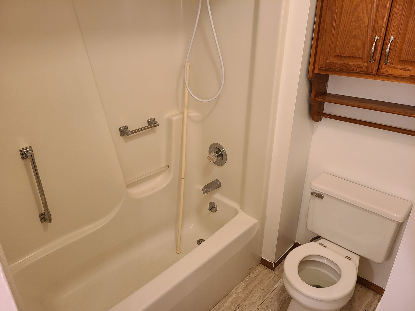 2001 Eagle Ridge Court, Unit A Urbana, IL 61802 - Photo 16 of 30 a bathroom with a sink a toilet and a bathtub