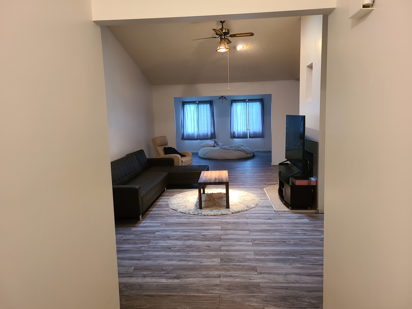 2001 Eagle Ridge Court, Unit A Urbana, IL 61802 - Photo 2 of 30 a living room with furniture and a chandelier