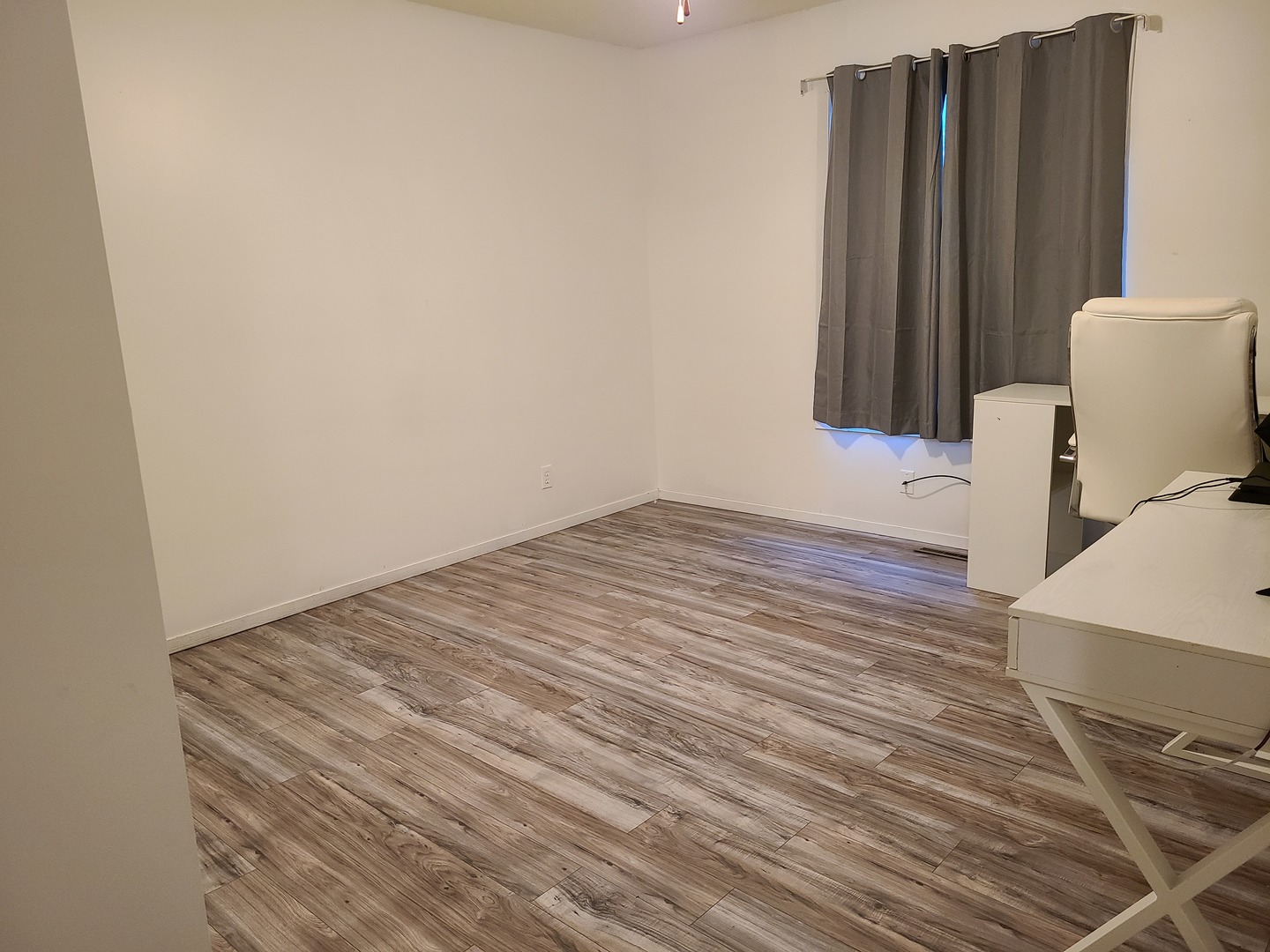 2001 Eagle Ridge Court, Unit A Urbana, IL 61802 - Photo 21 of 30 a view of a room with wooden floor and cabinet