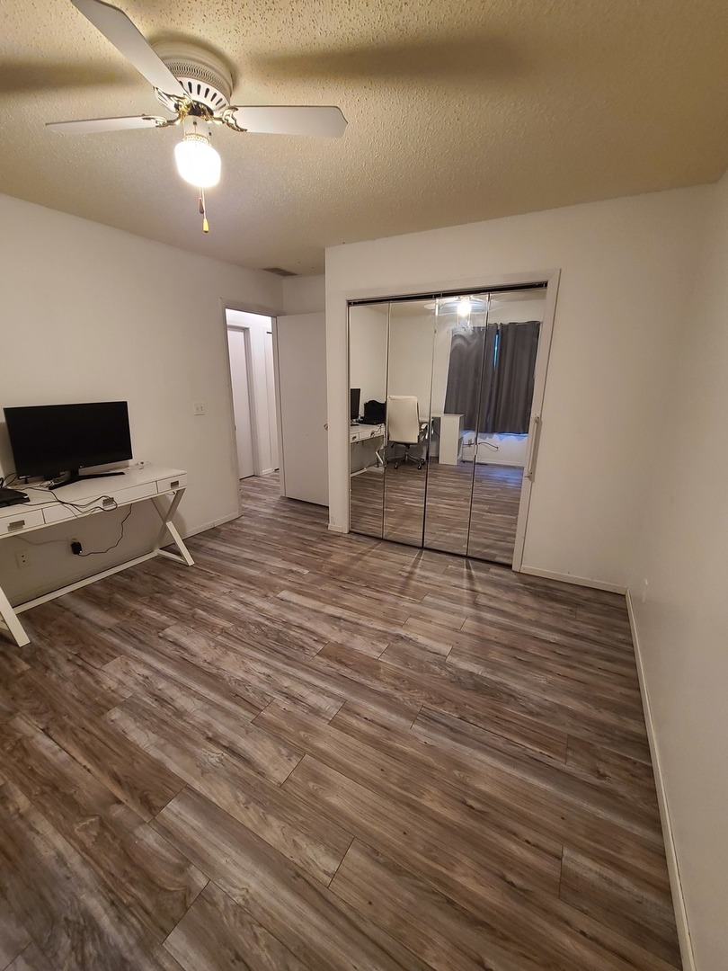 2001 Eagle Ridge Court, Unit A Urbana, IL 61802 - Photo 22 of 30 a living room with furniture and a flat screen tv