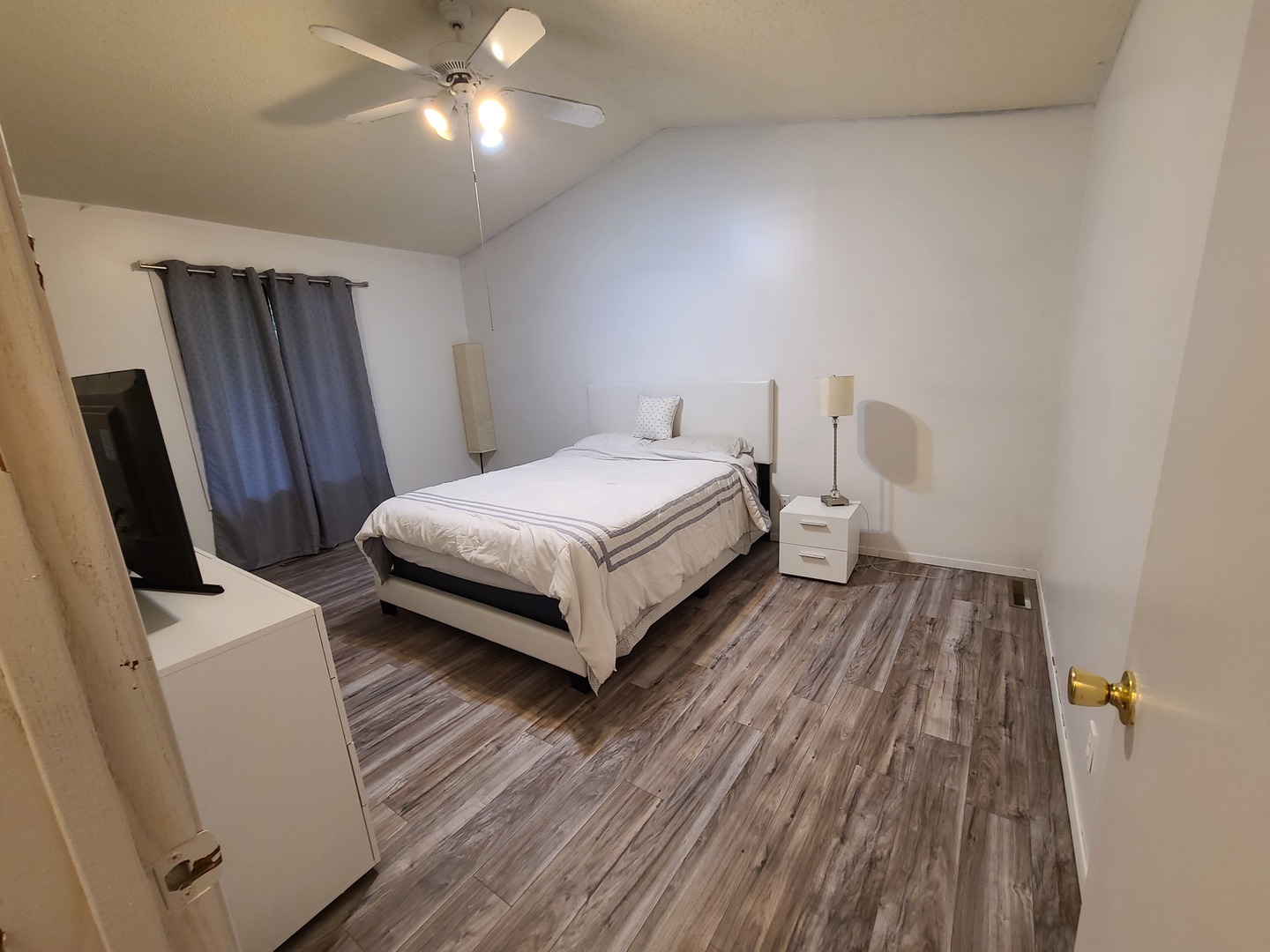 2001 Eagle Ridge Court, Unit A Urbana, IL 61802 - Photo 23 of 30 a bedroom with a bed and wooden floor