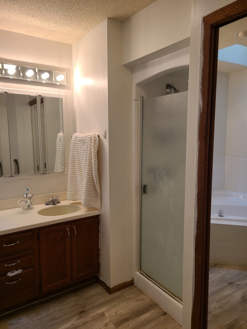 2001 Eagle Ridge Court, Unit A Urbana, IL 61802 - Photo 27 of 30 a bathroom with a double vanity sink and mirror