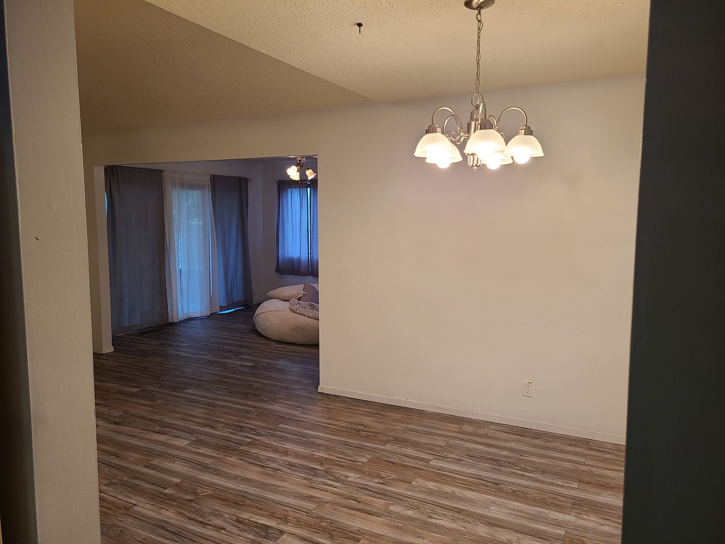 2001 Eagle Ridge Court, Unit A Urbana, IL 61802 - Photo 5 of 30 a view of a chandelier and wooden floor in a room