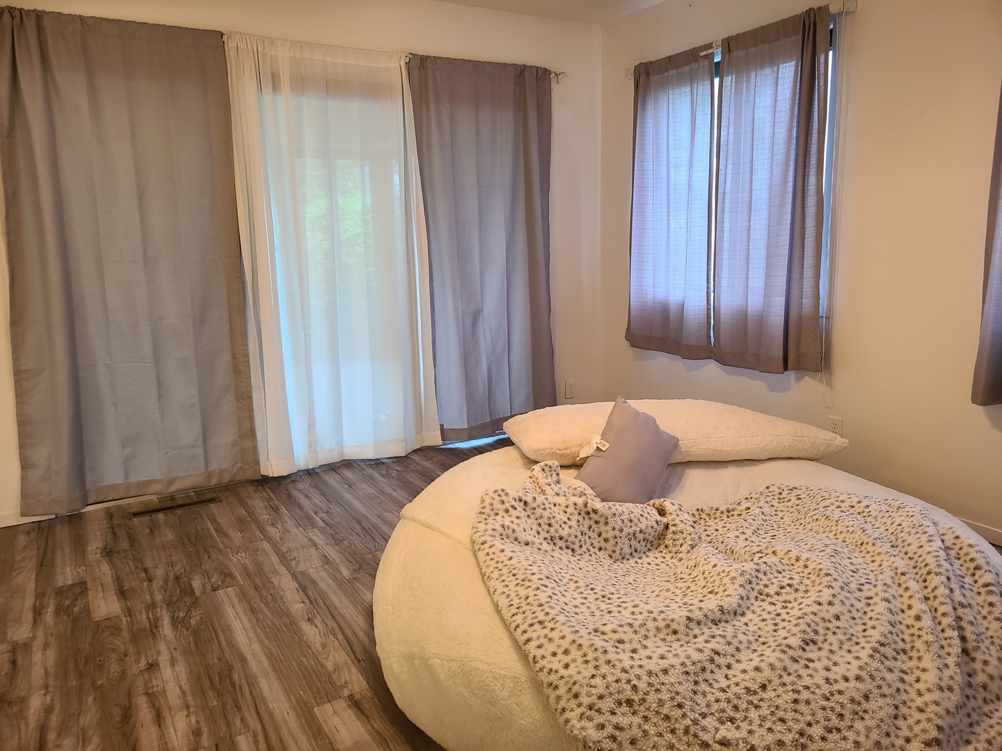 2001 Eagle Ridge Court, Unit A Urbana, IL 61802 - Photo 8 of 30 a bedroom with a bed and wooden floor