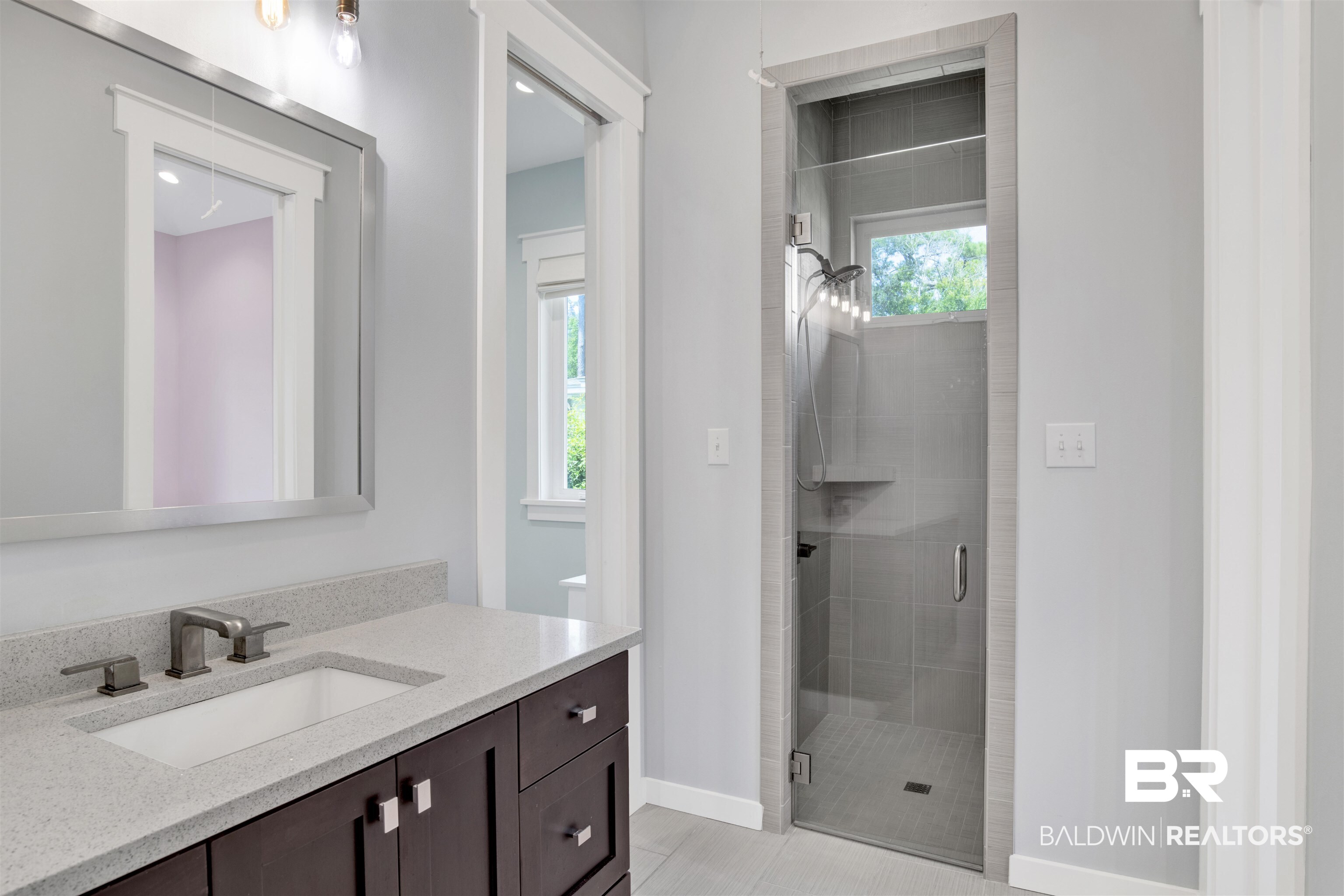 27980 Canal Road Orange Beach, AL 36561 - Photo 36 of 46 Full bathroom featuring vanity, a stall shower, and tile patterned floors