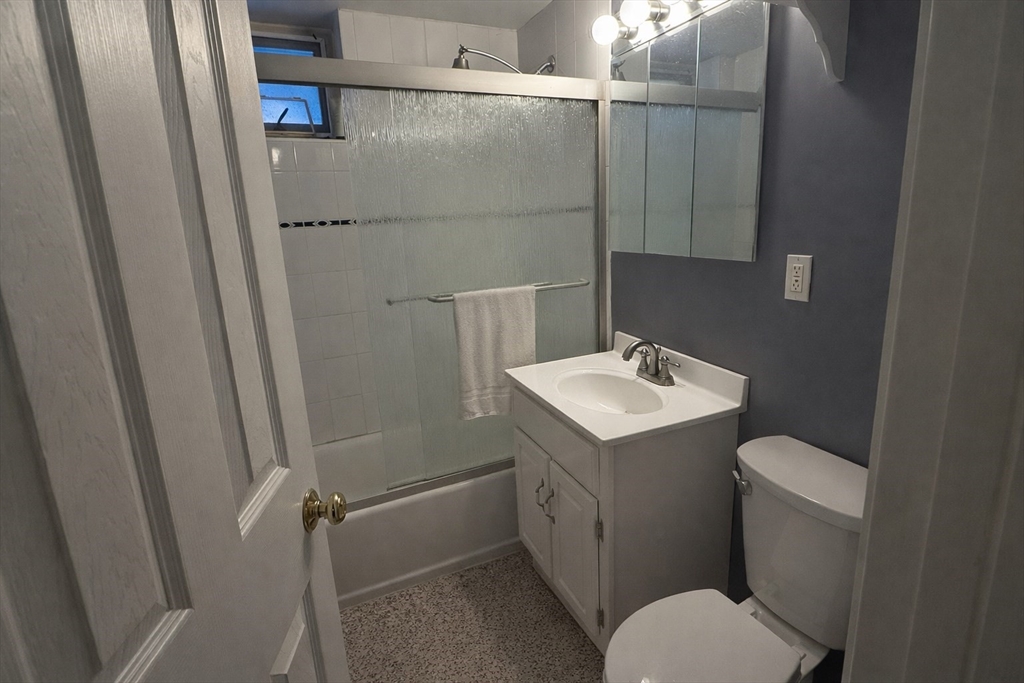 100 Marion Street, Unit B Brookline, MA 02446 - Photo 7 of 9 a bathroom with a sink toilet and shower