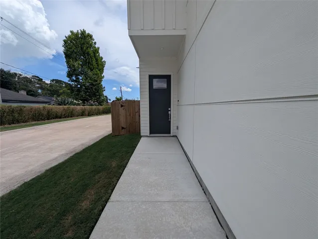 a view of a patio with a yard