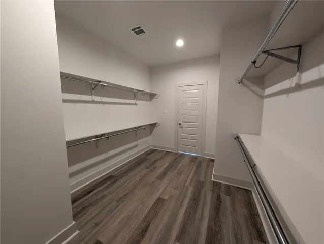 a view of an empty walk in closet