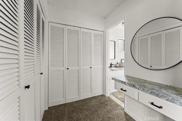 a view of a livingroom with wooden floor and cabinet