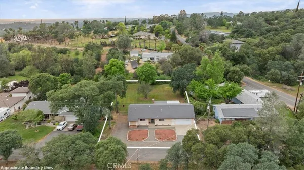 an aerial view of a house with a garden