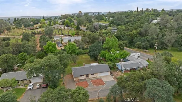 an aerial view of a house with outdoor space and street view