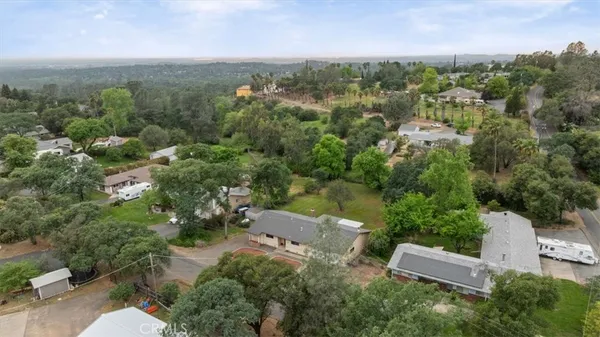 an aerial view of a house with mountain view