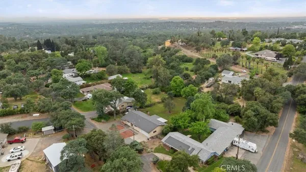 an aerial view of a house with lots of trees