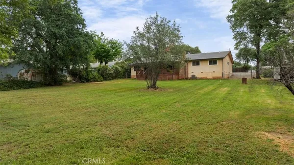 a house with trees in the background