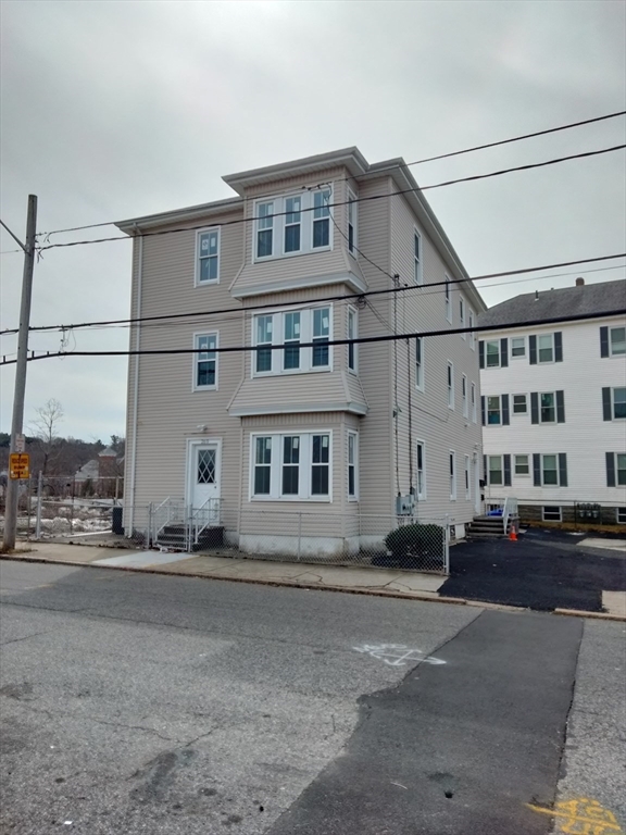 269 Brightman Street, Unit 3 Fall River, MA 02720 - Photo 1 of 14 a front view of a building with street