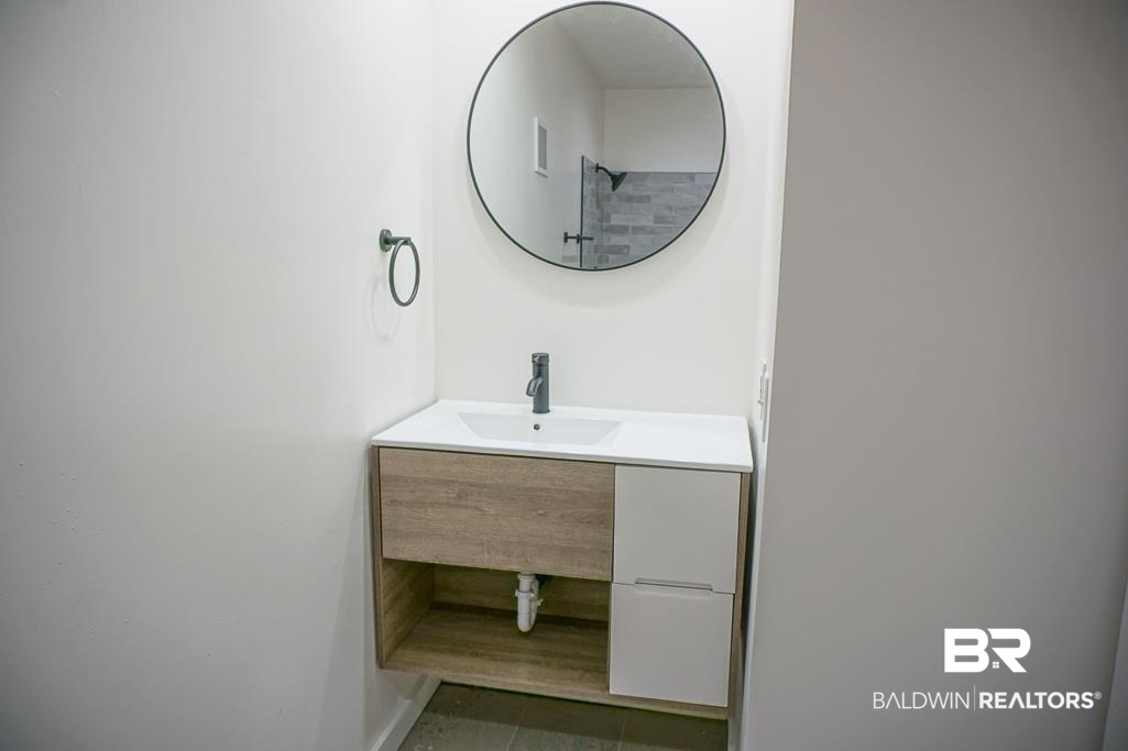 4159 Rebecca Road Mobile, AL 36609 - Photo 16 of 19 Bathroom with tile patterned flooring and vanity