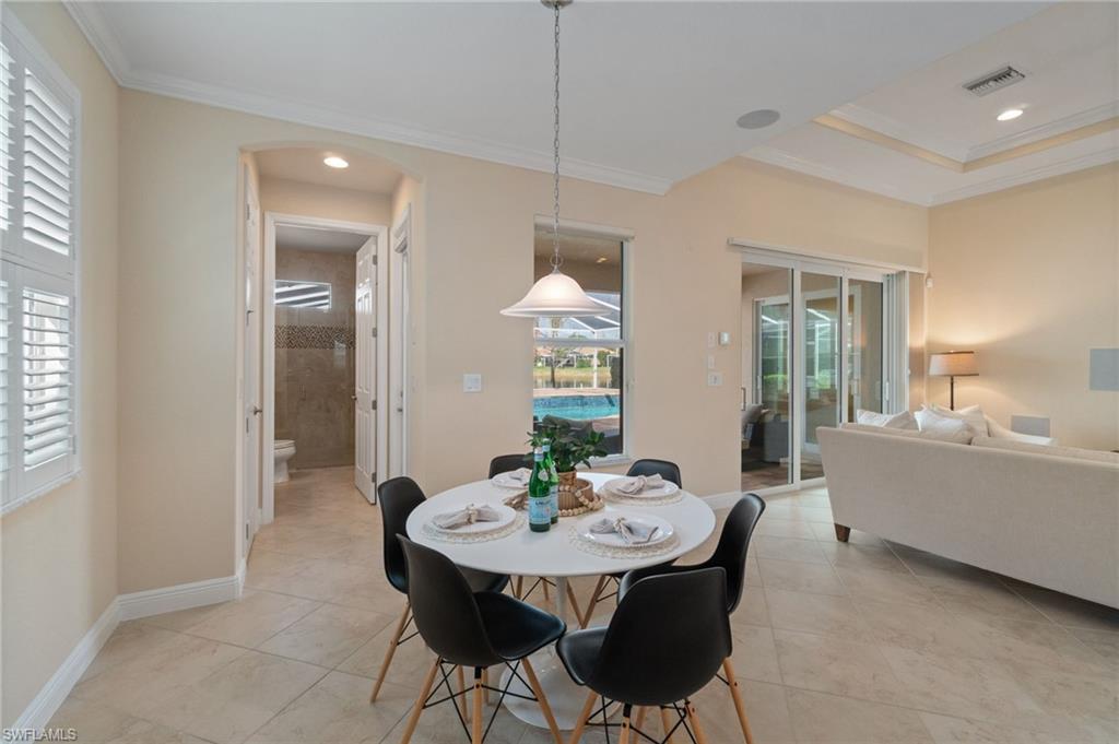 19753 Tesoro Way Estero, FL 33967 - Photo 10 of 47 a dining room with furniture and window