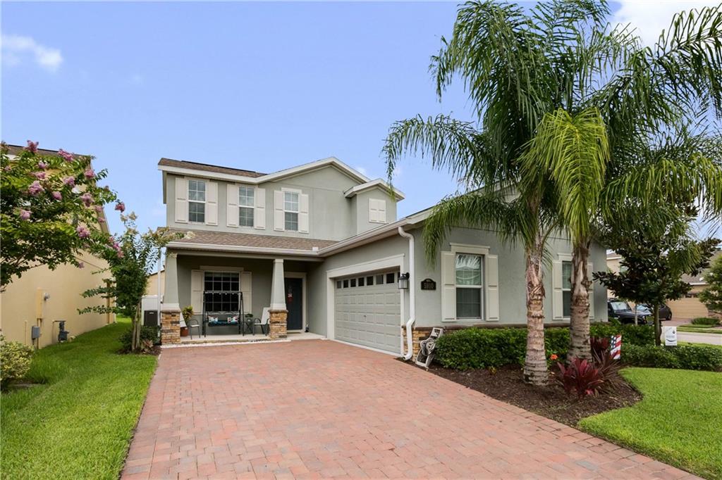 5910 Grassy Point Road Winter Garden, FL 34787 - Photo 1 of 1 Welcome Home Driveway with side facing garage.