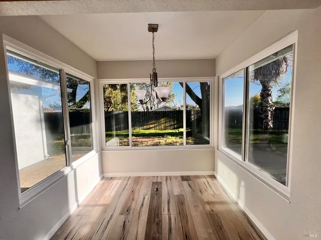 a view of a living room and front door