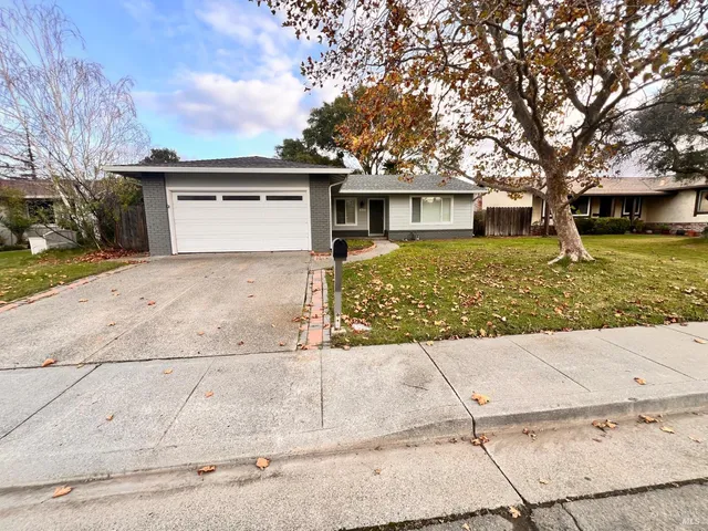 front view of a house with a yard